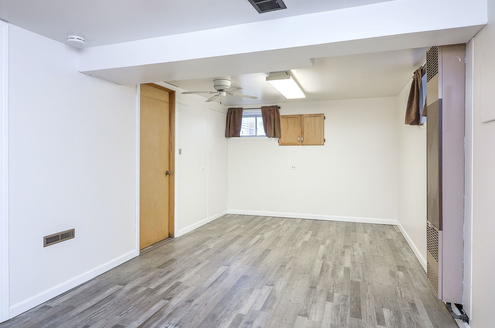 3210 Madison Avenue Brookfield, IL 60513 - Photo 18 of 27 a view of empty room with wooden floor