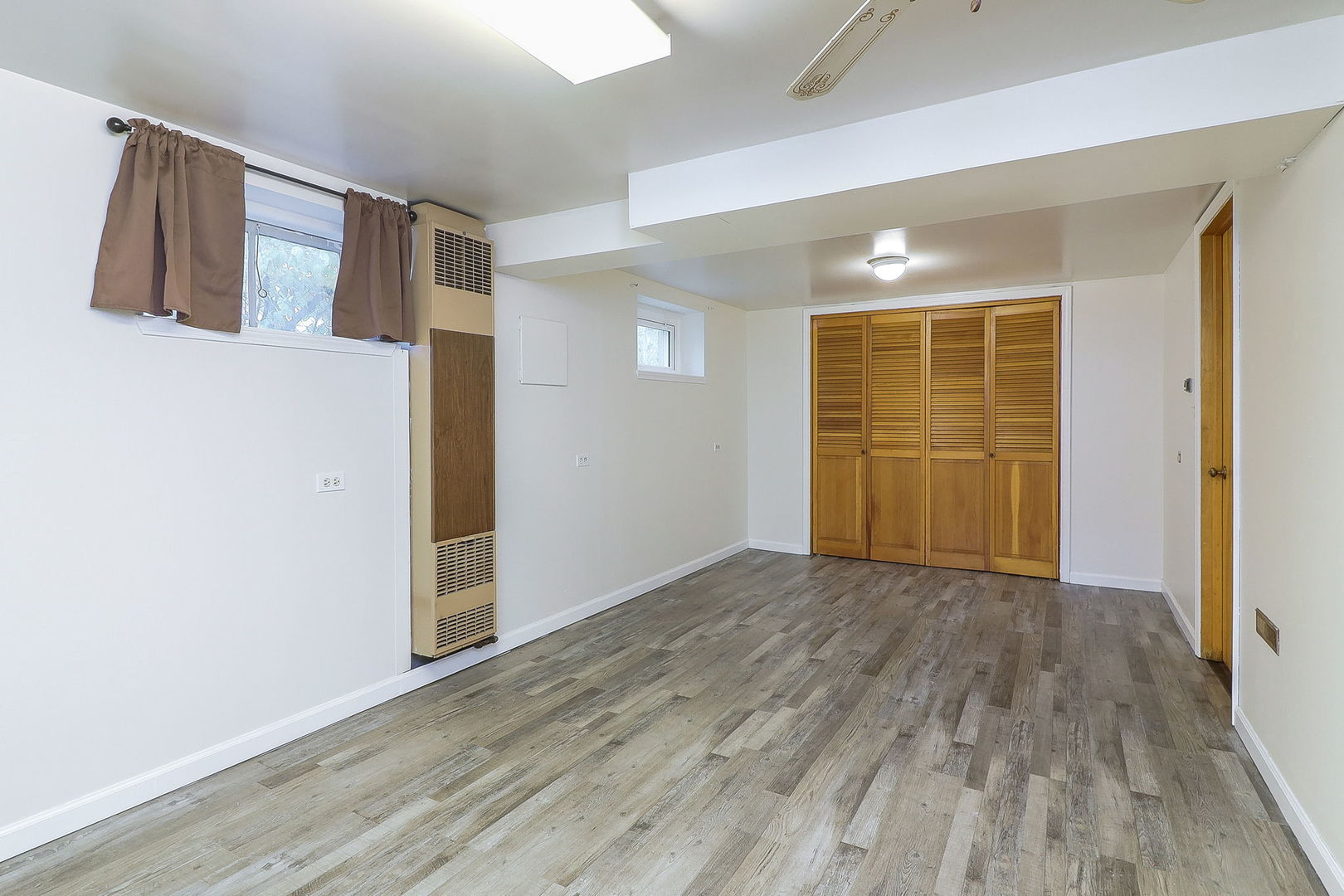 3210 Madison Avenue Brookfield, IL 60513 - Photo 19 of 27 an empty room with wooden floor and windows