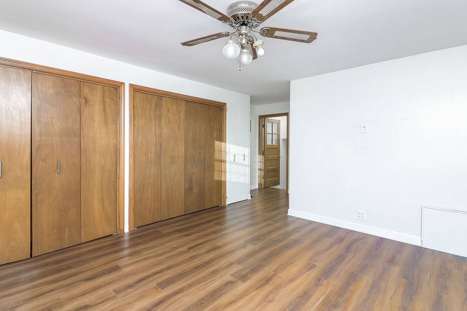 3210 Madison Avenue Brookfield, IL 60513 - Photo 10 of 27 a view of an empty room with wooden floor