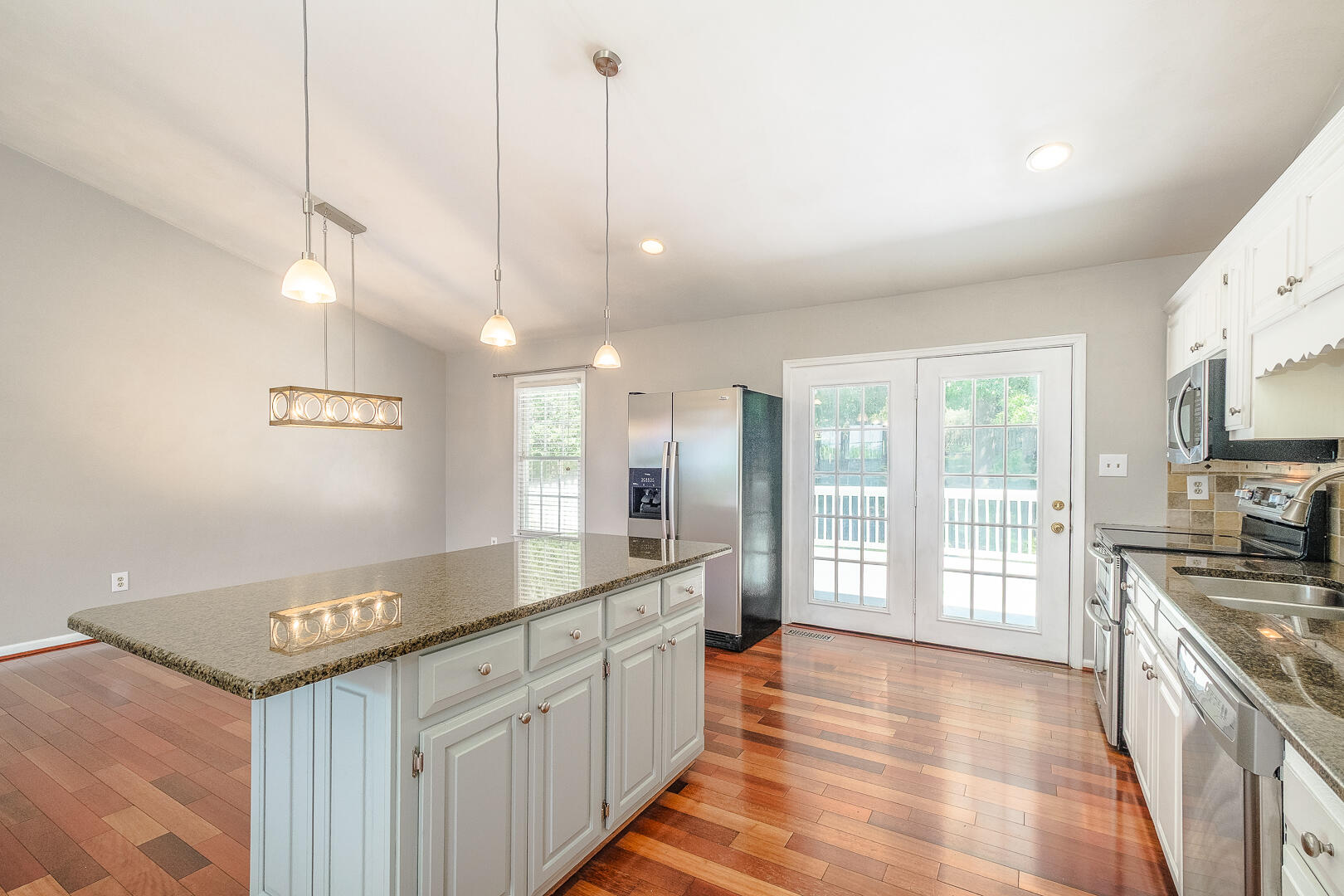 5443 Setter Road Roanoke, VA 24012 - Photo 12 of 42 a large kitchen with kitchen island a large counter space a sink appliances and cabinets