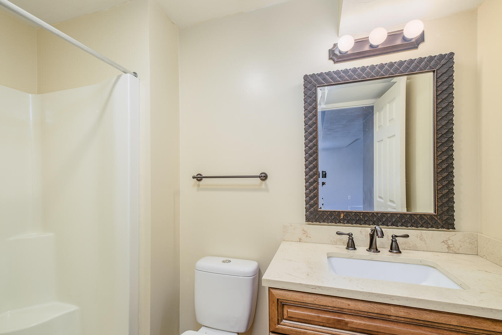 5443 Setter Road Roanoke, VA 24012 - Photo 27 of 42 a bathroom with a sink a toilet and a mirror