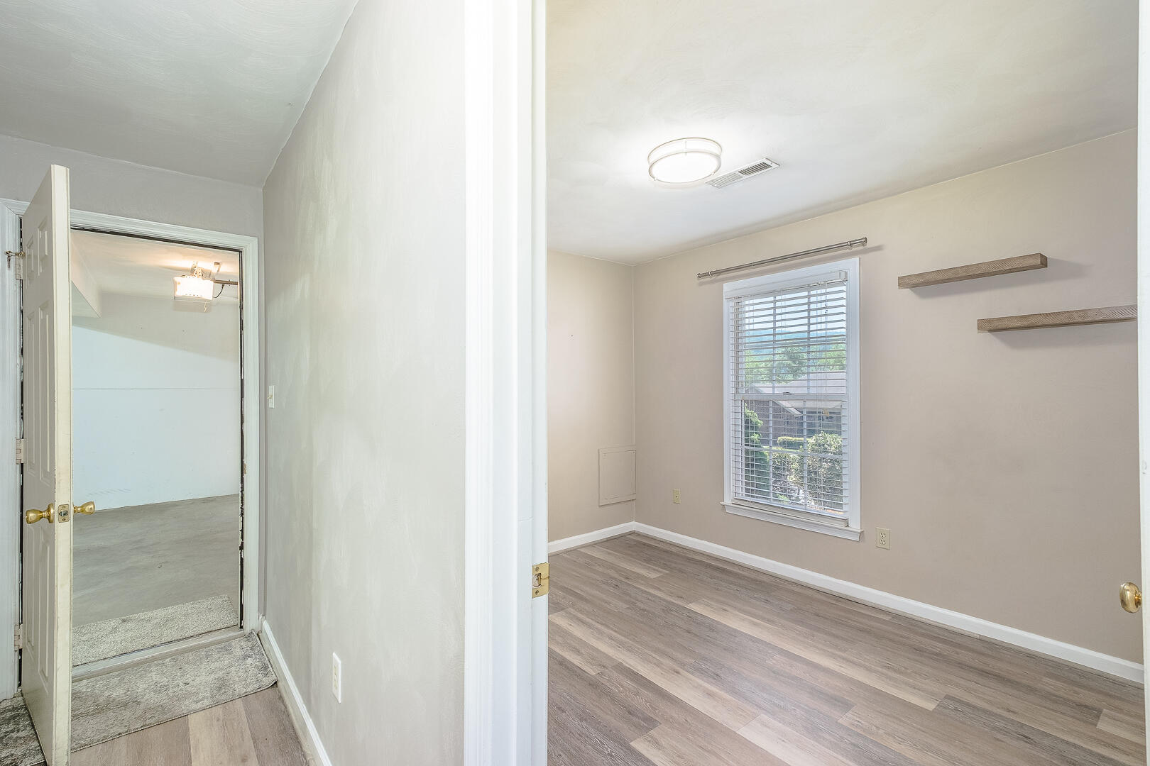 5443 Setter Road Roanoke, VA 24012 - Photo 29 of 42 a view of empty room with wooden floor and fan