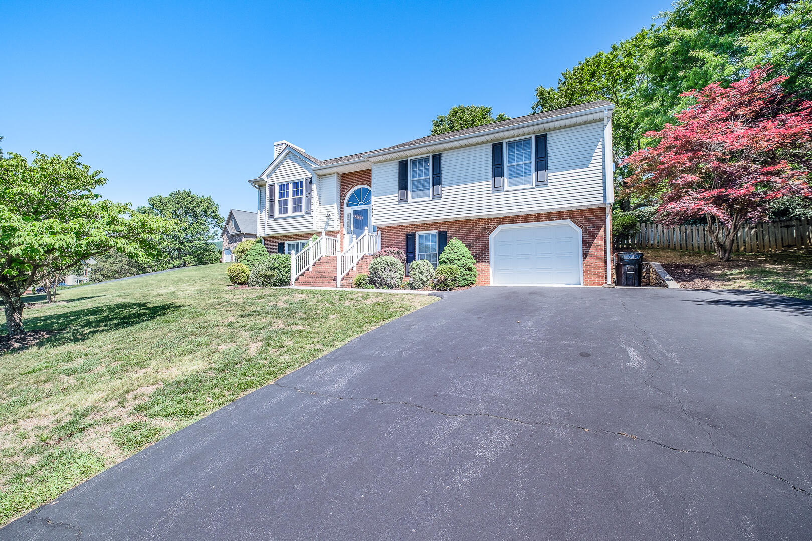 5443 Setter Road Roanoke, VA 24012 - Photo 39 of 42 a front view of a house with a yard and garage
