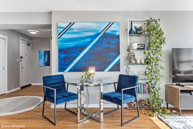a bathroom with a granite countertop toilet sink and mirror
