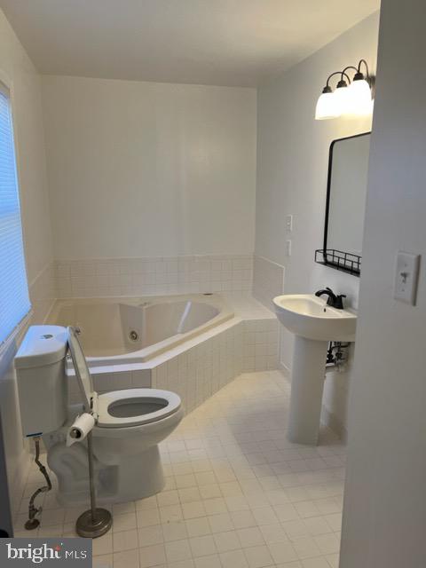 17207 Manning Drive Accokeek, MD 20607 - Photo 11 of 18 a bathroom with a sink toilet and a mirror