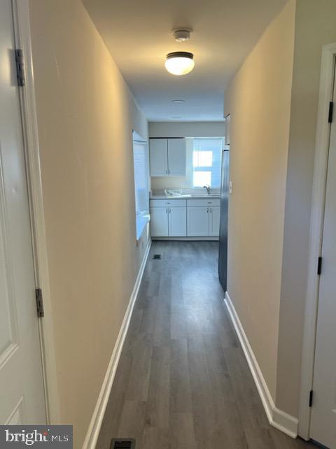 17207 Manning Drive Accokeek, MD 20607 - Photo 12 of 18 a view of a hallway with wooden floor
