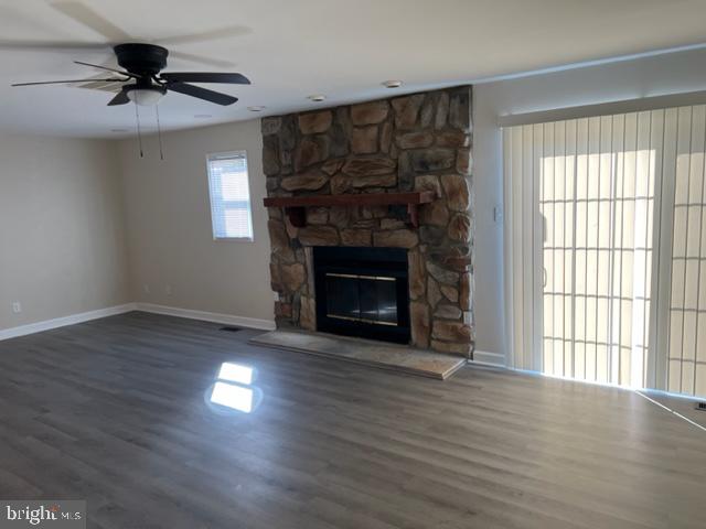 17207 Manning Drive Accokeek, MD 20607 - Photo 2 of 18 a view of an empty room with wooden floor fireplace and a window