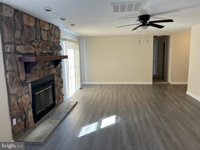 17207 Manning Drive Accokeek, MD 20607 - Photo 3 of 18 a view of a livingroom with a fireplace a ceiling fan and wooden floor