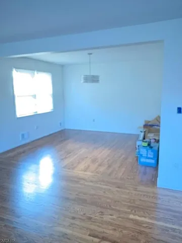 a view of room and hardwood floor