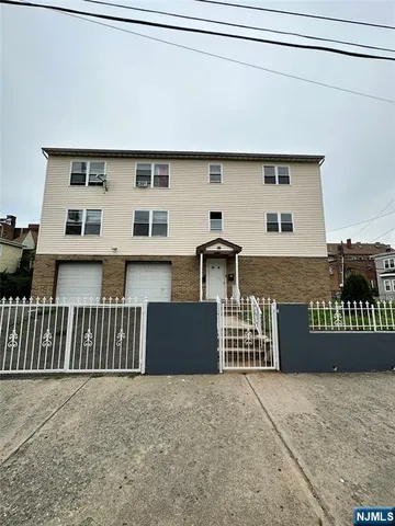 a front view of a house with wooden stairs