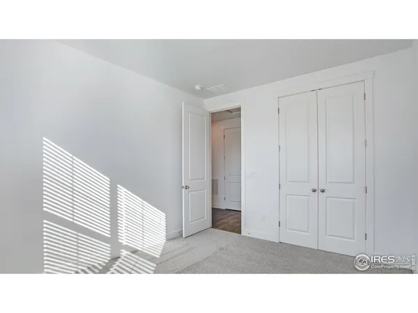 an aerial view of residential houses with outdoor space and river