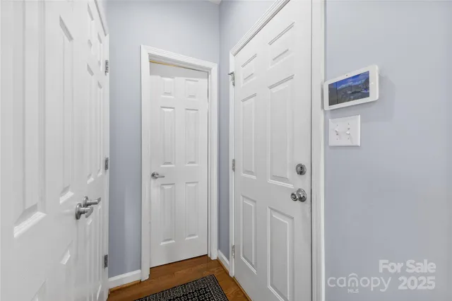 a kitchen with cabinets a sink a stove a dining table and chairs