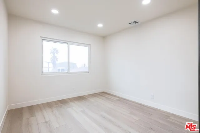 a bathroom with a sink shower and mirror