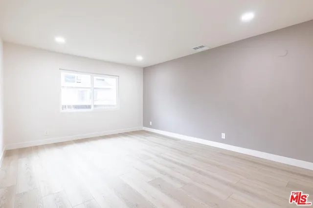 a bathroom with a shower sink and mirror