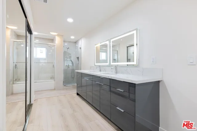 a bathroom with a sink and mirror