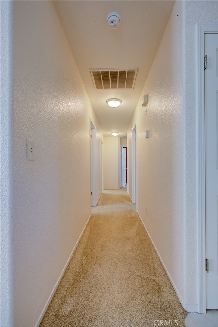 2341 Mesquite Court Merced, CA 95348 - Photo 13 of 17 a view of a hallway