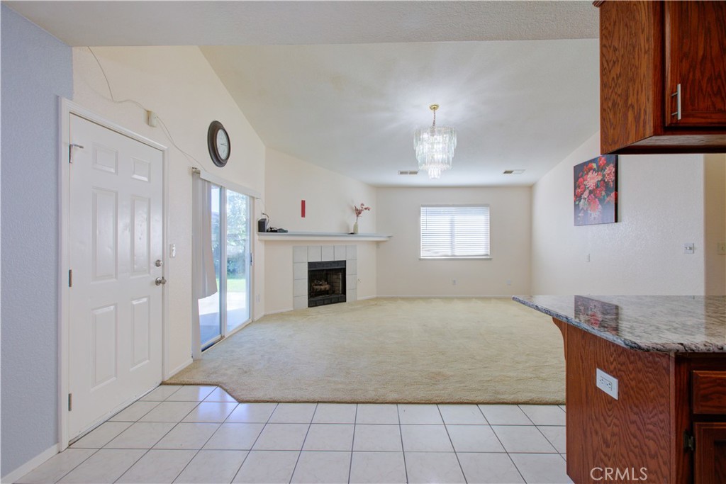 2341 Mesquite Court Merced, CA 95348 - Photo 5 of 17 a view of an empty room with window and fireplace