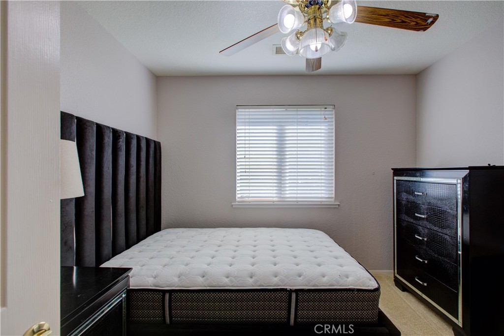 2341 Mesquite Court Merced, CA 95348 - Photo 8 of 17 a view of a room with window and wooden floor
