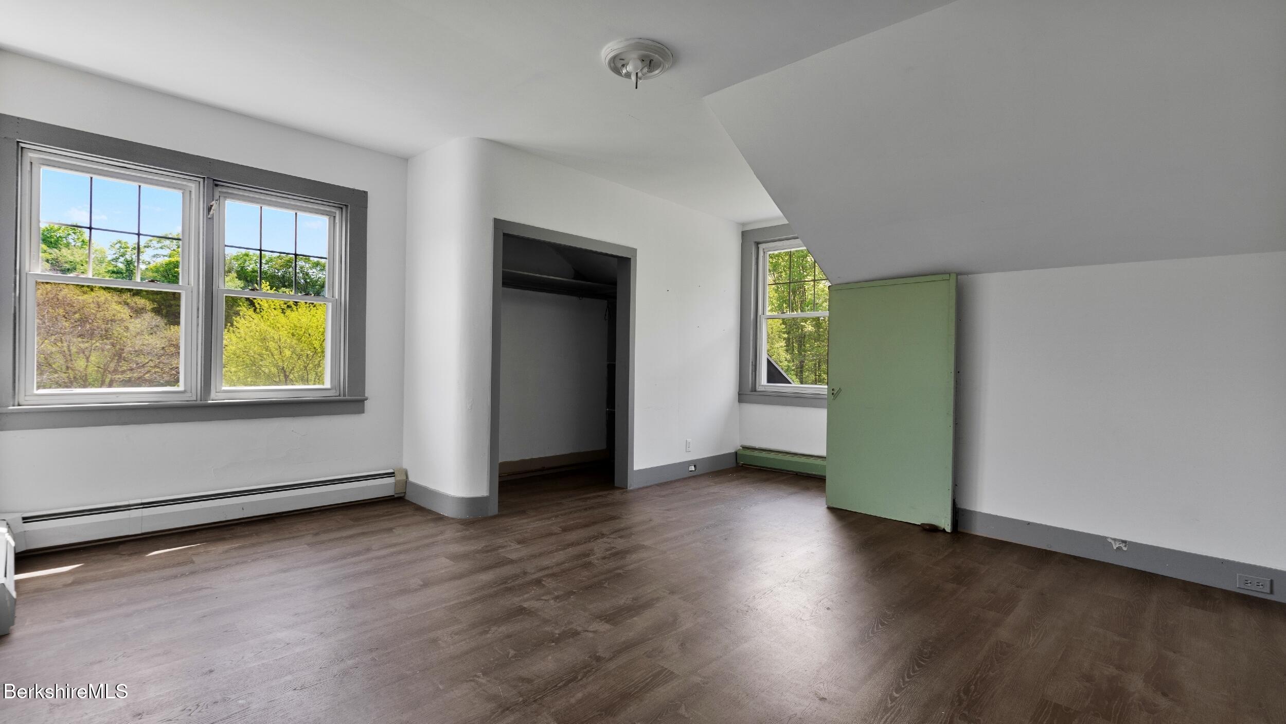 20 East Dugway Road Lenox, MA 01240 - Photo 39 of 84 an empty room with wooden floor and windows