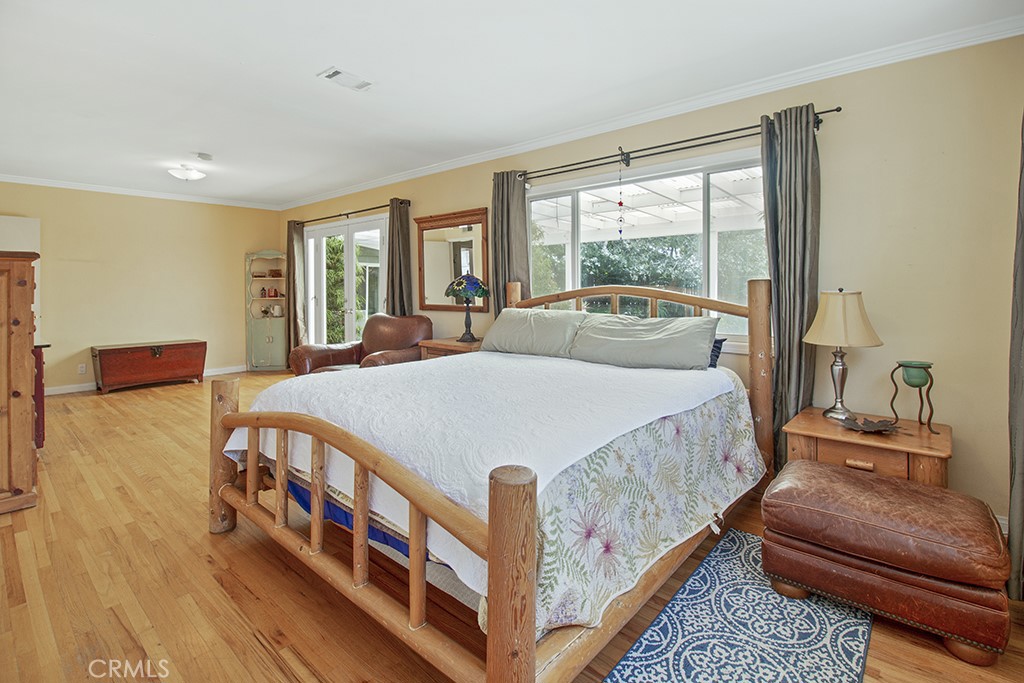 2726 Tapo Street Simi Valley, CA 93063 - Photo 17 of 48 a large bedroom with a bed and wooden floor