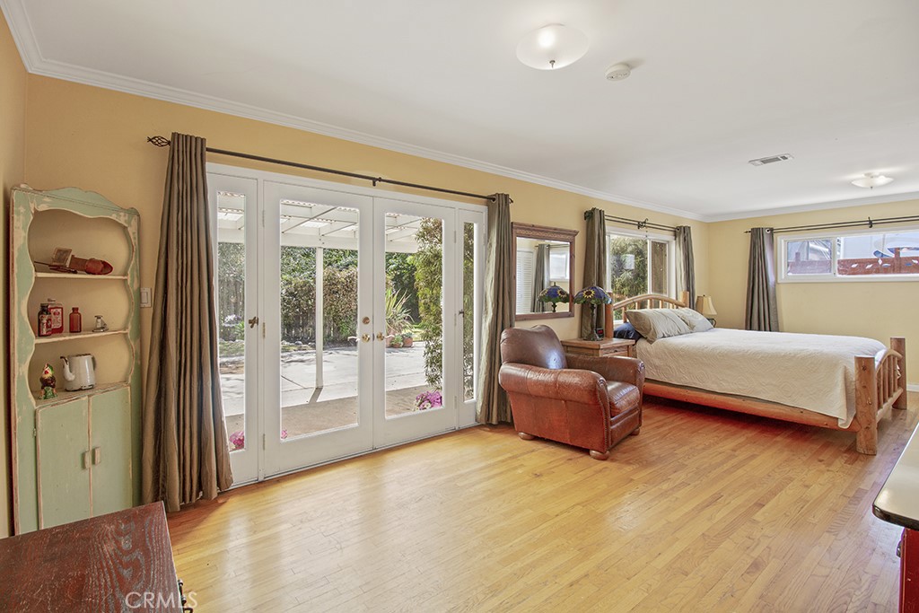 2726 Tapo Street Simi Valley, CA 93063 - Photo 19 of 48 a bedroom with furniture and large windows