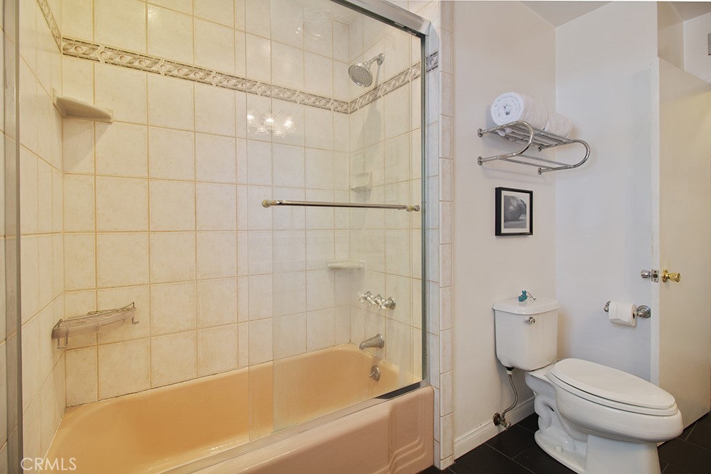 2726 Tapo Street Simi Valley, CA 93063 - Photo 21 of 48 a bathroom with a bathtub and toilet