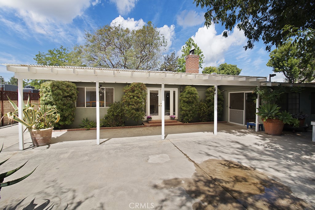 2726 Tapo Street Simi Valley, CA 93063 - Photo 32 of 48 front view of house with potted plants and a large tree