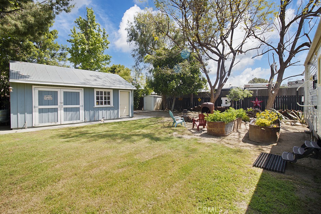2726 Tapo Street Simi Valley, CA 93063 - Photo 38 of 48 a swimming pool with outdoor seating and yard