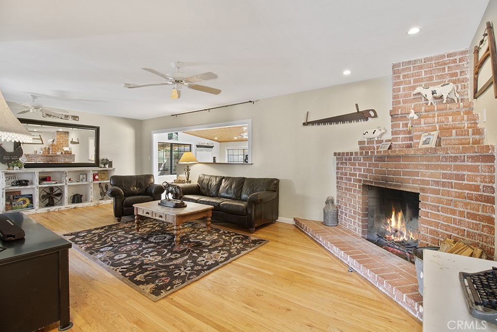 2726 Tapo Street Simi Valley, CA 93063 - Photo 4 of 48 a living room with furniture or couch and a fireplace