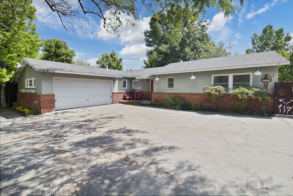 2726 Tapo Street Simi Valley, CA 93063 - Photo 43 of 48 front view of a house with a yard