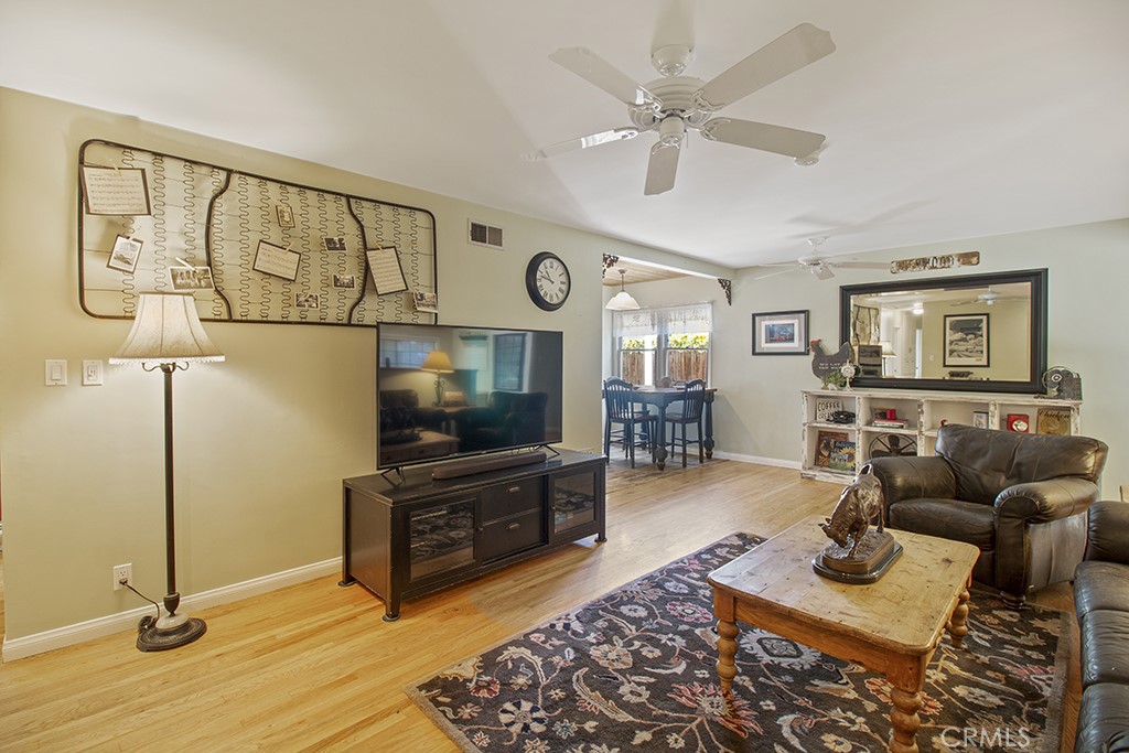 2726 Tapo Street Simi Valley, CA 93063 - Photo 5 of 48 a living room with furniture and a flat screen tv