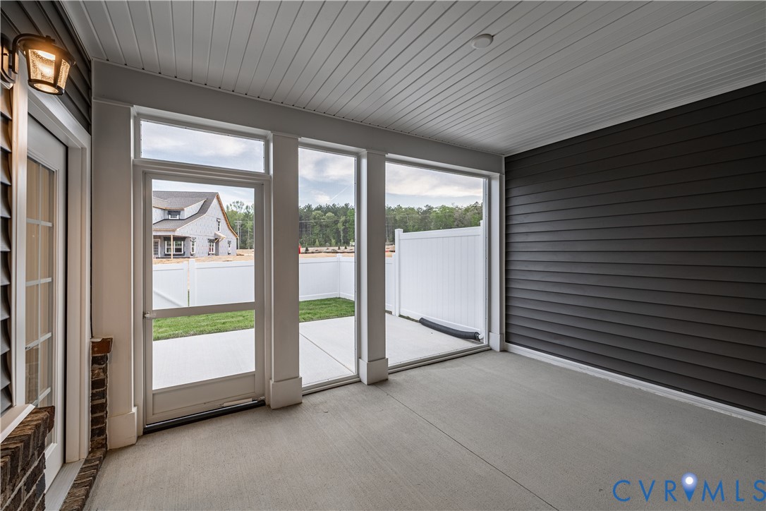 6715 Mayland Ridge Lane Moseley, VA 23120 - Photo 5 of 14 a view of an empty room with a fireplace