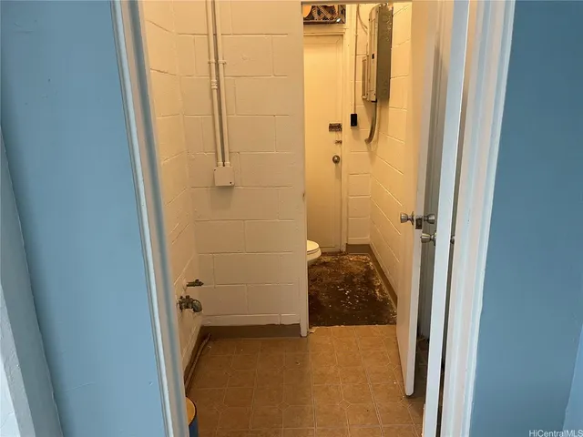 a bathroom with a granite countertop shower
