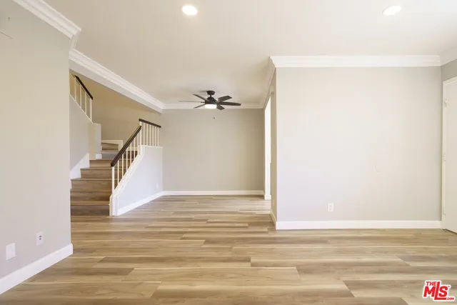 a view of a hallway view with wooden floor