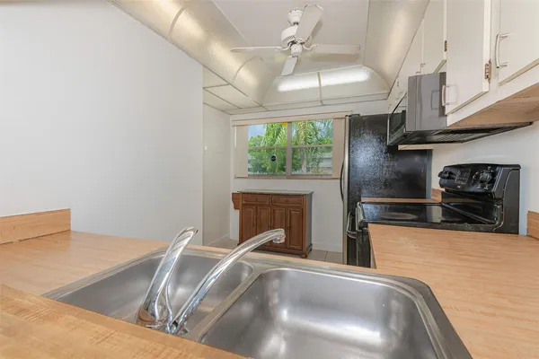 a view of a kitchen with furniture and a fireplace