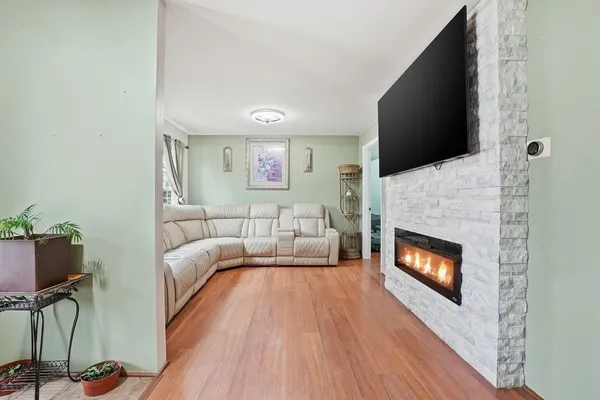 a bedroom with a bed and a fireplace