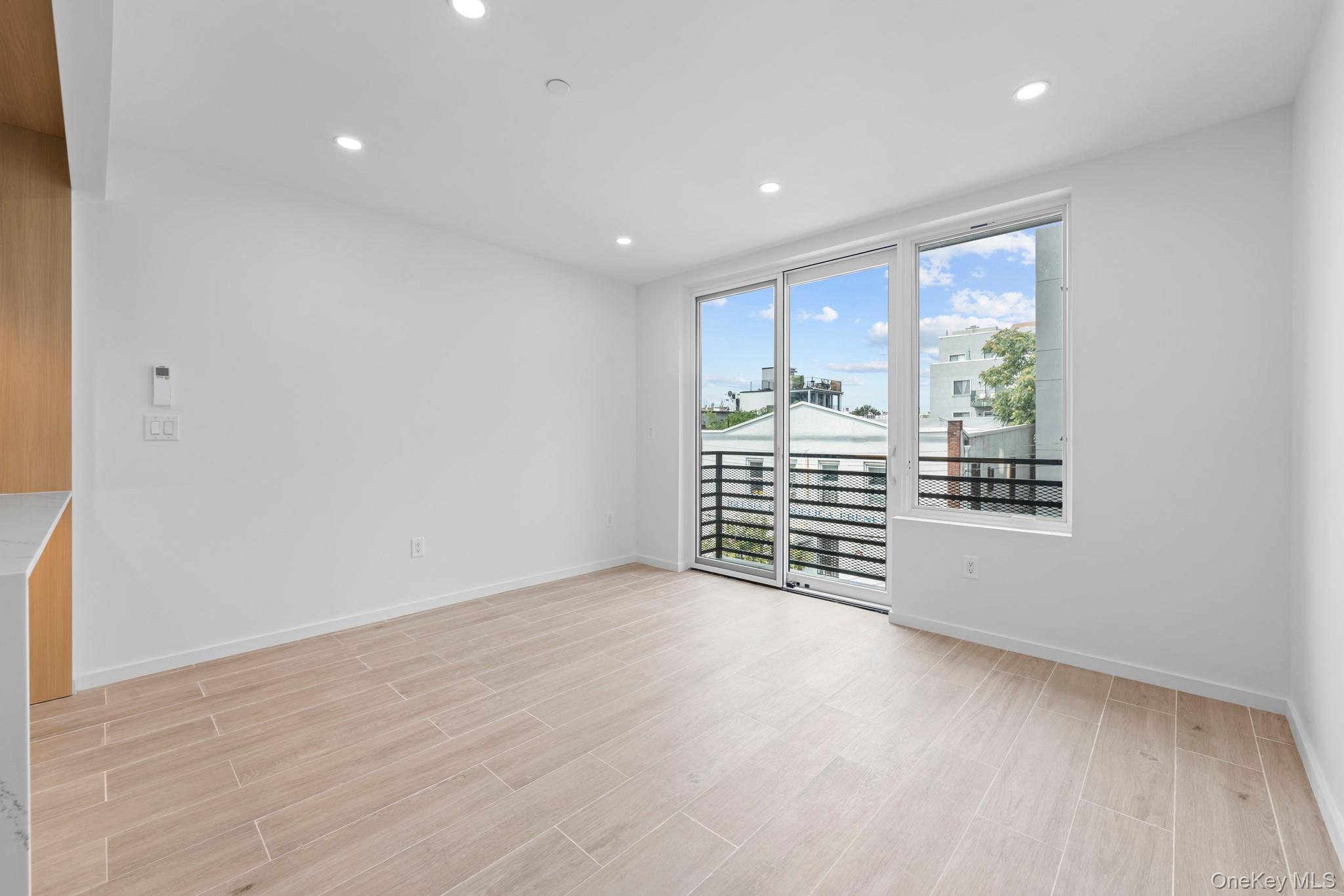 366 Harman Street, Unit 4F Brooklyn, NY 11237 - Photo 11 of 17 Unfurnished room with wood finish floors and recessed lighting