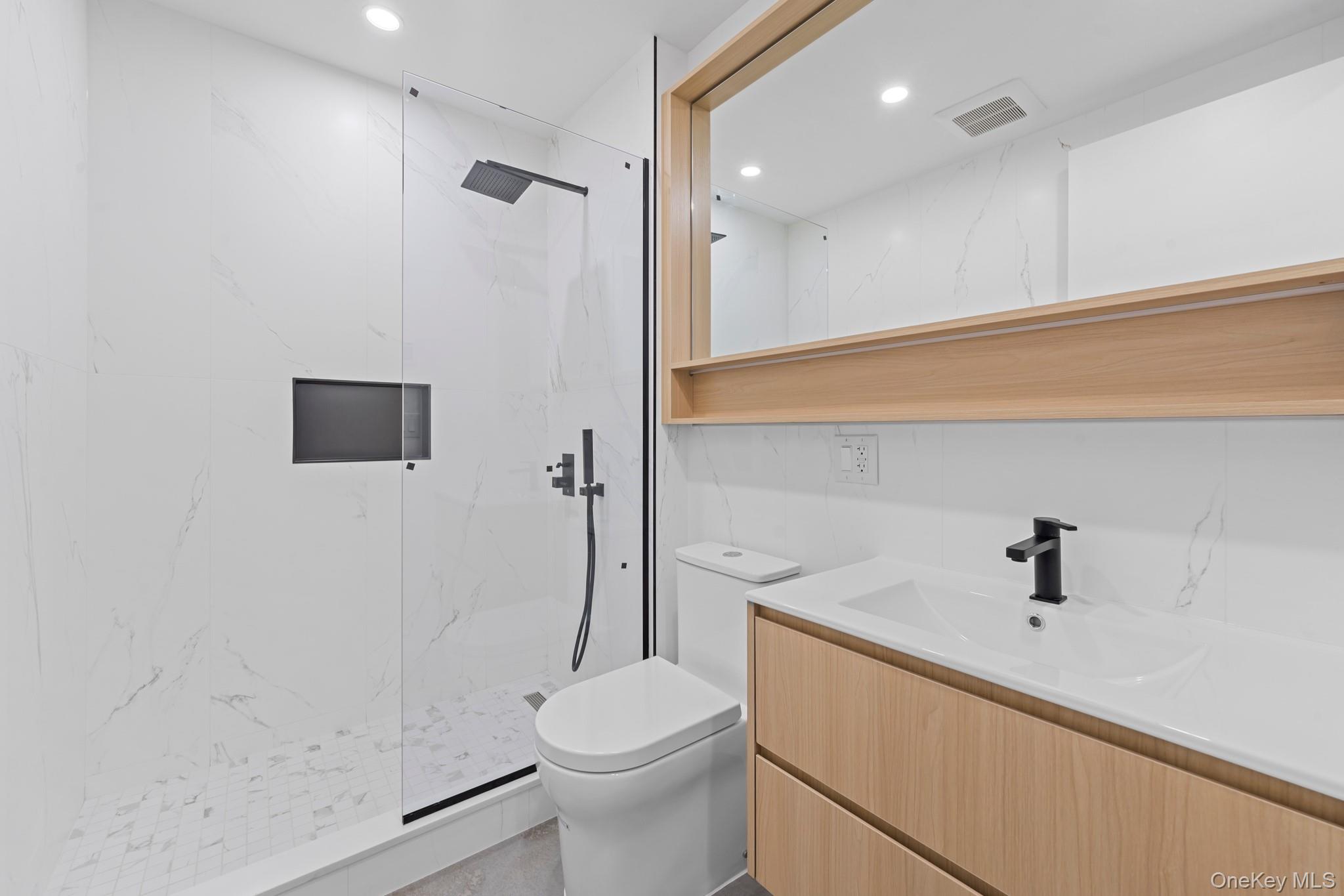 366 Harman Street, Unit 4F Brooklyn, NY 11237 - Photo 17 of 17 Full bath featuring vanity, a marble finish shower, and recessed lighting