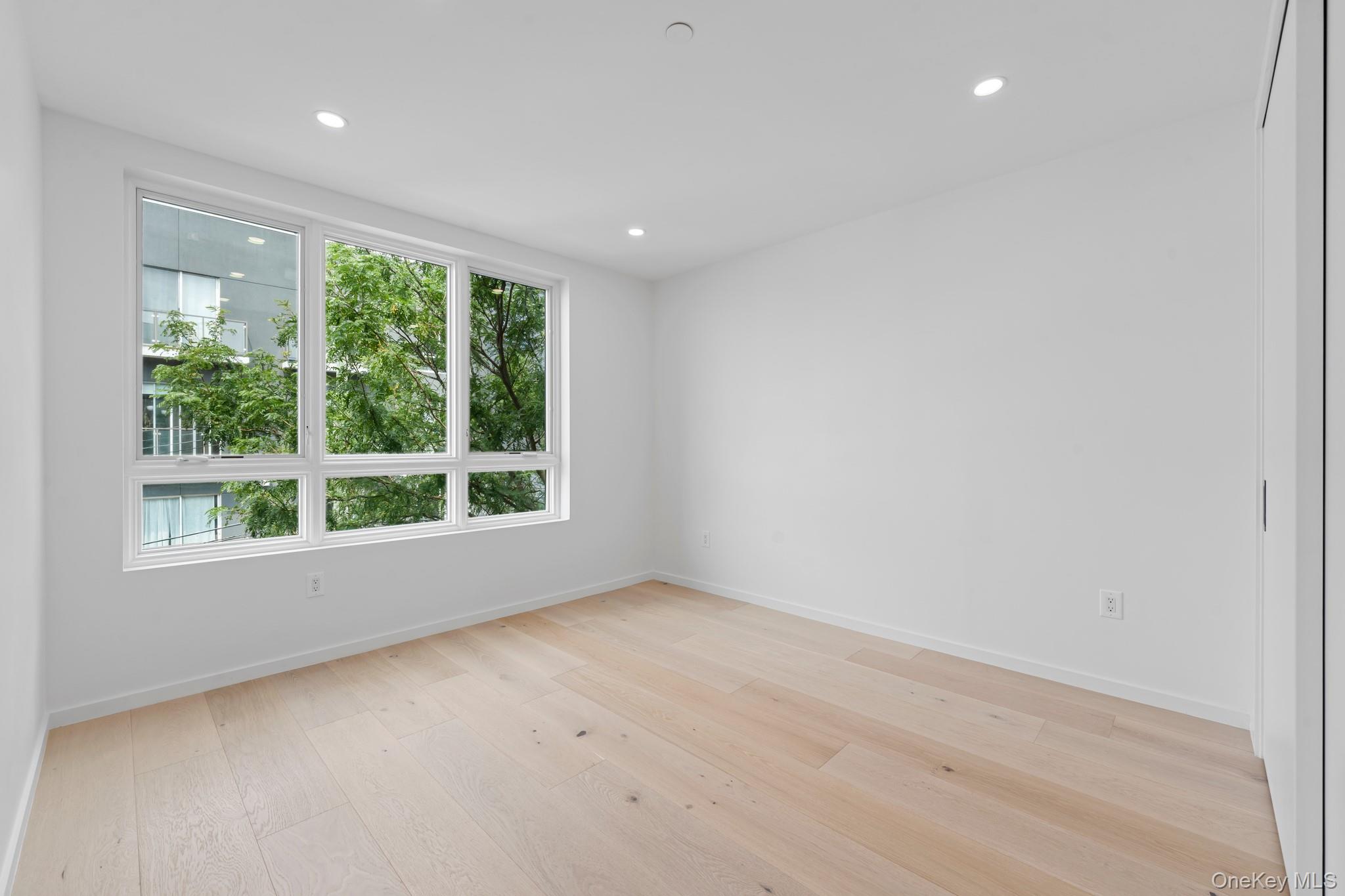 366 Harman Street, Unit 4F Brooklyn, NY 11237 - Photo 9 of 17 Unfurnished room with recessed lighting and light wood-style floors