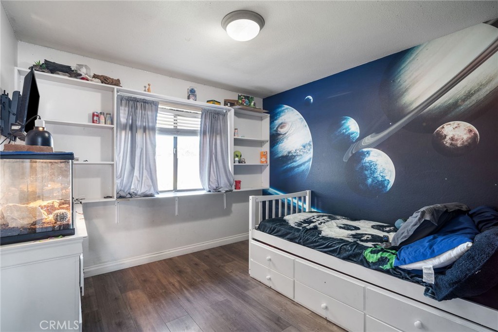 29773 Gifhorn Road Menifee, CA 92584 - Photo 11 of 25 a kitchen with granite countertop a stove and a sink