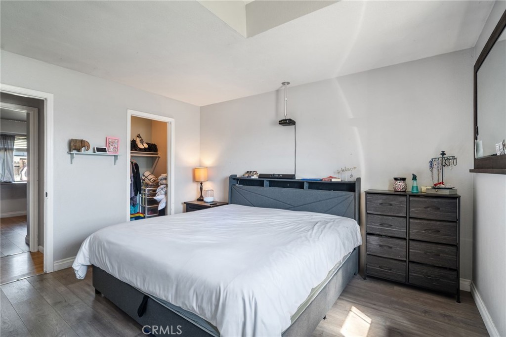 29773 Gifhorn Road Menifee, CA 92584 - Photo 12 of 25 a bedroom with a bed and a closet