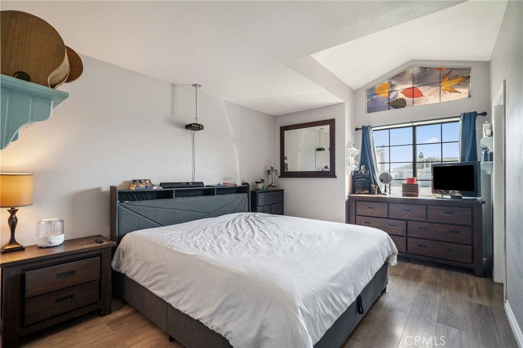 29773 Gifhorn Road Menifee, CA 92584 - Photo 13 of 25 a spacious bedroom with a bed and a dresser