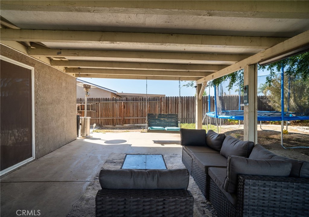 29773 Gifhorn Road Menifee, CA 92584 - Photo 15 of 25 a living room with furniture and a large window