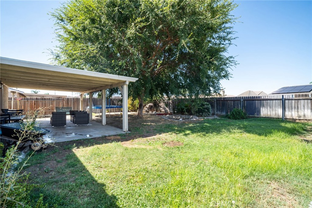 29773 Gifhorn Road Menifee, CA 92584 - Photo 16 of 25 a view of a house with backyard and sitting area