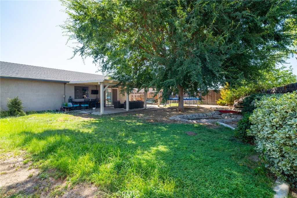 29773 Gifhorn Road Menifee, CA 92584 - Photo 18 of 25 a view of a house with backyard porch and sitting area