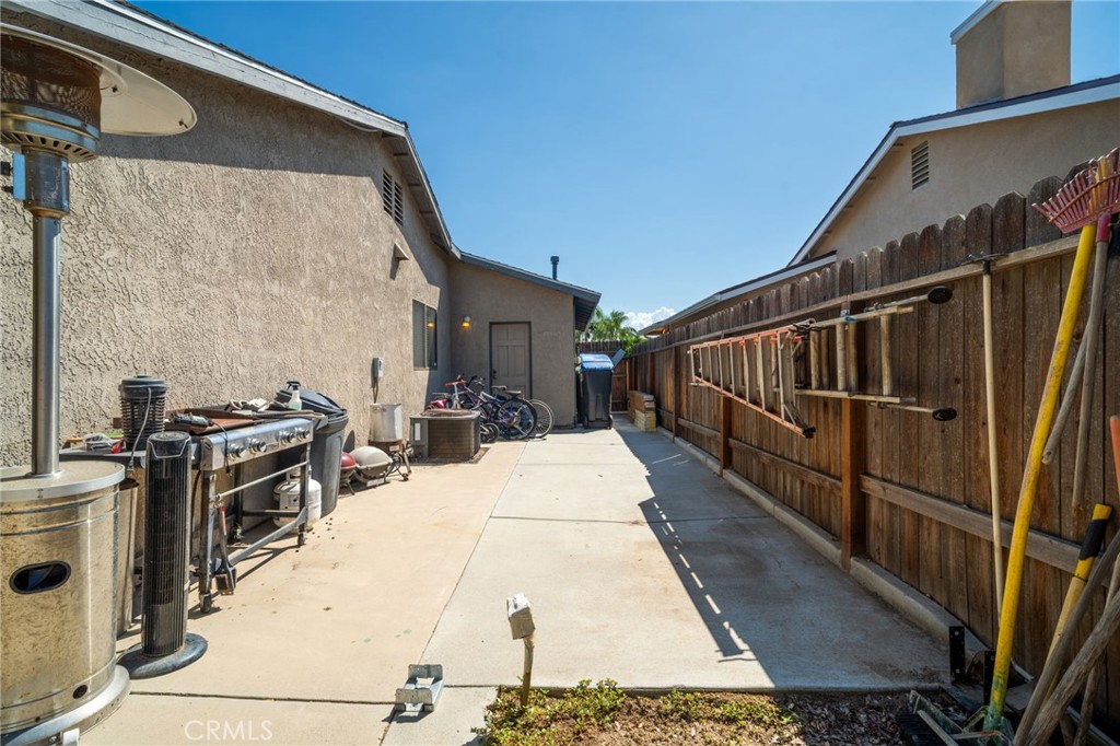 29773 Gifhorn Road Menifee, CA 92584 - Photo 21 of 25 a view of a balcony with wooden floor and front door