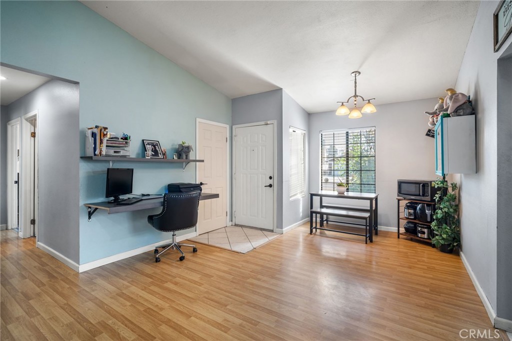 29773 Gifhorn Road Menifee, CA 92584 - Photo 3 of 25 a view of a workspace with furniture and a window