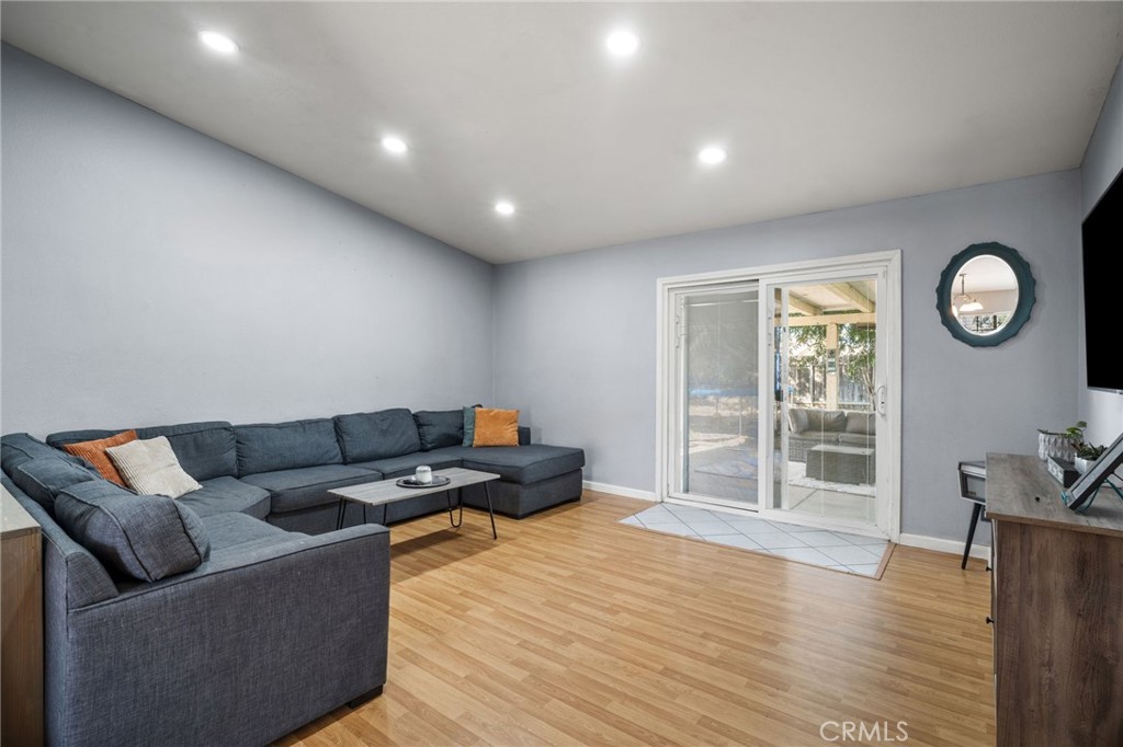 29773 Gifhorn Road Menifee, CA 92584 - Photo 6 of 25 a living room with furniture and wooden floor