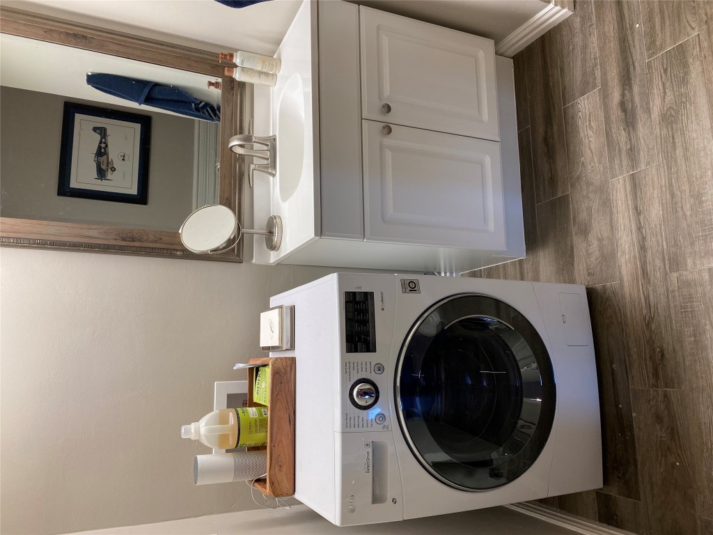 1122 Colorado Street, Unit 1802 Austin, TX 78701 - Photo 4 of 9 a utility room with sink dryer and washer