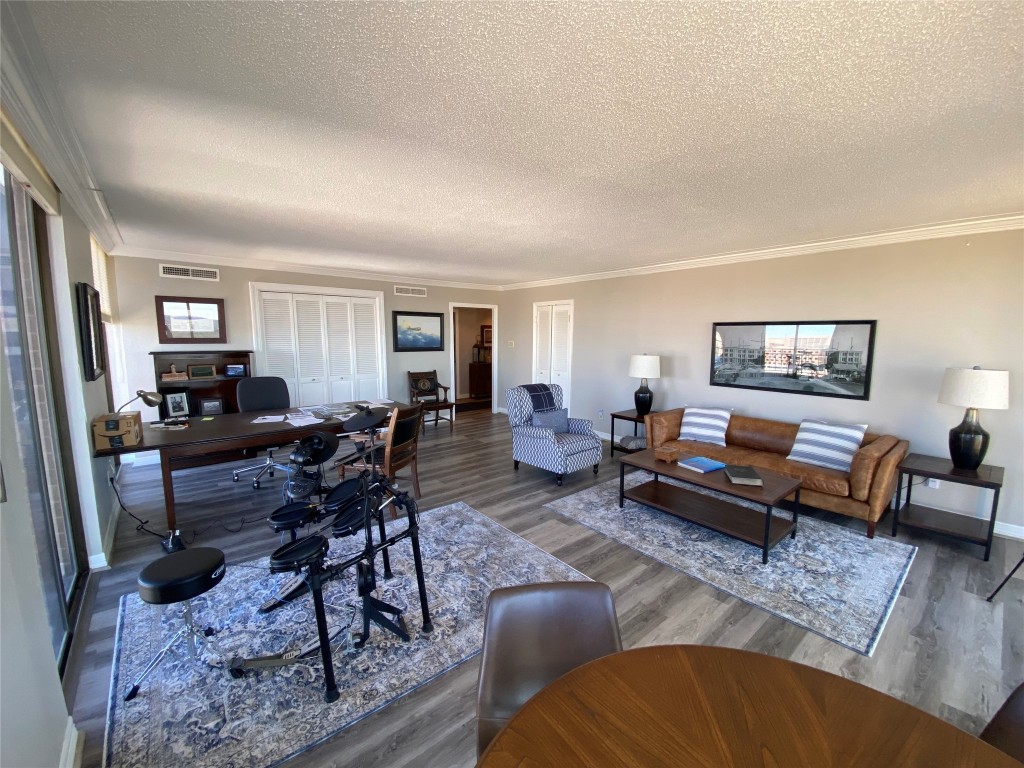 1122 Colorado Street, Unit 1802 Austin, TX 78701 - Photo 7 of 9 a living room with furniture a rug and a window